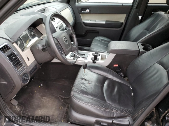 2009 Mercury Mariner Premier with VIN 4M2CU97G39KJ24297, listed as a Copart auction lot 77472674 with 153,316 mi miles and Salvage Title. Bid and sale history available at carsss.com. Image 7.