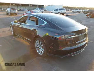 2013 Tesla Model S with VIN 5YJSA1CN7DFP22690, listed as a IAAI auction lot 40981089 with 188,057 mi miles. Bid and sale history available at carsss.com. Image 3.