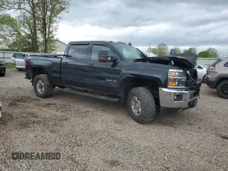2015 Chevrolet Silverado 3500HD LT z VIN 1GC4KZCG5FF671954, wystawiony jako Copart lot #56741195 z przebiegiem Nie podano mil oraz Szkody całkowita. Historia ofert i sprzedaży dostępna na DreamBid. Obrazek 4.