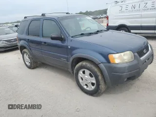 2001 Ford Escape XLT with VIN 1FMYU03131KF10968, listed as a Copart auction lot 67849474 with 197,328 mi miles and Salvage Title. Bid and sale history available at carsss.com. Image 4.