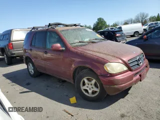 2001 Mercedes-Benz M 320/430/500 with VIN 4JGAB54E91A256176, listed as a Copart auction lot 55610525 with 215,120 mi miles and Salvage Title. Bid and sale history available at DreamBid. Image 4.