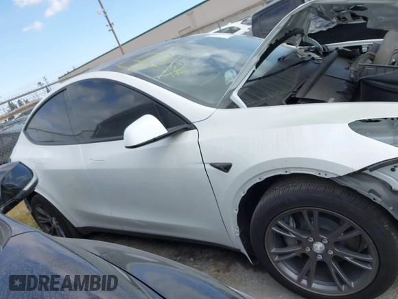 2024 Tesla Model Y with VIN 7SAYGDED2RF207783, listed as a IAAI auction lot 41758143 with Not Provided miles and . Bid and sale history available at DreamBid. Image 13.