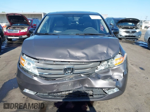 2012 Honda Odyssey Touring with VIN 5FNRL5H95CB057346, listed as a IAAI auction lot 42644094 with 114,712 mi miles and . Bid and sale history available at DreamBid. Image 6.