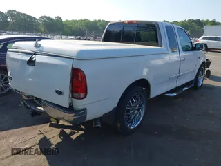 2000 Ford F-150 XL with VIN 1FTRX17L7YNB73649, listed as a IAAI auction lot 42159021 with Not provided miles and . Bid and sale history available at DreamBid. Image 4.