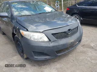 2010 Toyota Corolla with VIN 2T1BU4EE0AC521946, listed as a IAAI auction lot 42049301 with 169,807 mi miles. Bid and sale history available at carsss.com. Image 6.