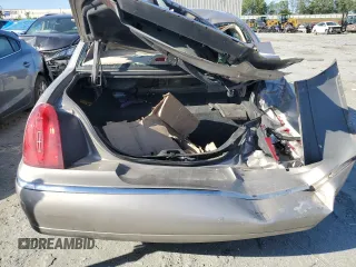 1999 Lincoln Town Car Signature z VIN 1LNHM82W7XY626305, wystawiony jako Copart lot #58009475 z przebiegiem Nie podano mil oraz Szkoda całkowita • Salvage title. Historia ofert i sprzedaży dostępna na DreamBid. Obrazek 6.