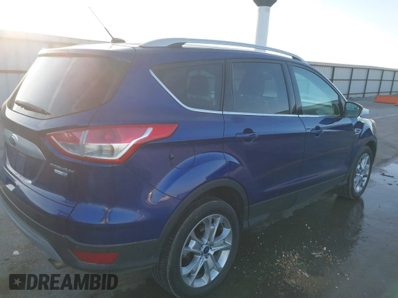2014 Ford Escape Titanium with VIN 1FMCU9JX4EUD30964, listed as a IAAI auction lot 41772153 with 179,481 mi miles and . Bid and sale history available at DreamBid. Image 4.