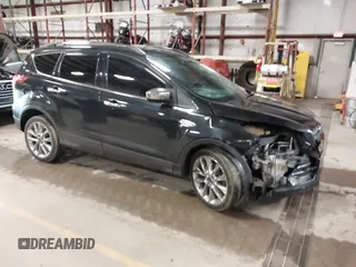 2015 Ford Escape SE with VIN 1FMCU9G9XFUA70029, listed as a IAAI auction lot 41673827 with 82,043 mi miles. Bid and sale history available at carsss.com. Image 1.