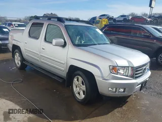 2014 Honda Ridgeline RTL with VIN 5FPYK1F51EB012843, listed as a IAAI auction lot 41629002 with 114,761 mi miles. Bid and sale history available at carsss.com. Image 1.