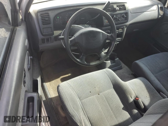1999 Nissan Frontier XE with VIN 1N6DD26S4XC319806, listed as a Copart auction lot 54233635 with 311,759 mi miles and Clean title. Bid and sale history available at DreamBid. Image 8.