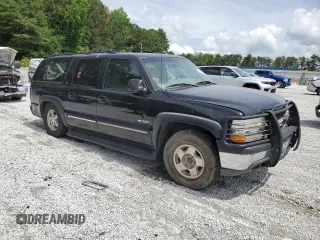 2000 Chevrolet Suburban LS with VIN 3GNFK16T5YG190971, listed as a Copart auction lot 60264695 with Not provided miles and Salvage title. Bid and sale history available at DreamBid. Image 4.
