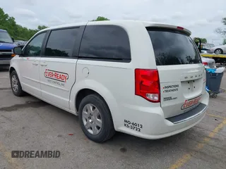 2013 Dodge Grand Caravan SE with VIN 2C4RDGBG8DR505844, listed as a IAAI auction lot 42139152 with 206,399 mi miles and . Bid and sale history available at DreamBid. Image 3.