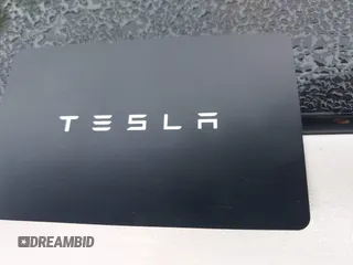 2021 Tesla Model 3 Long Range with VIN 5YJ3E1EB8MF974007, listed as a IAAI auction lot 41915513 with 107,354 mi miles and . Bid and sale history available at carsss.com. Image 11.