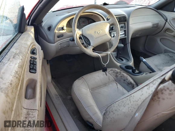 1999 Ford Mustang z VIN 1FAFP4443XF106725, wystawiony jako Copart lot #77011284 z przebiegiem Nie podano mil oraz Szkoda całkowita • Salvage title. Historia ofert i sprzedaży dostępna na DreamBid. Obrazek 8.