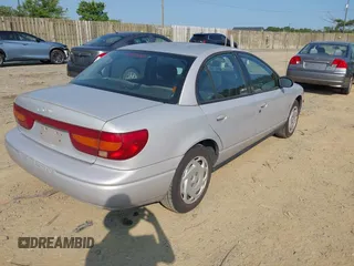 2001 Saturn SL z VIN 1G8ZK52771Z269242, wystawiony jako IAAI lot #42425226 z przebiegiem 129 539 mil mil oraz . Historia ofert i sprzedaży dostępna na DreamBid. Obrazek 4.