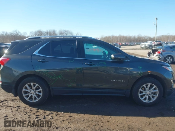 2018 Chevrolet Equinox LT z VIN 2GNAXSEV2J6122861, wystawiony jako IAAI lot #41741471 z przebiegiem 121 123 mil mil oraz . Historia ofert i sprzedaży dostępna na DreamBid. Obrazek 13.