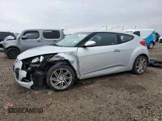 2013 Hyundai Veloster w/Black Int z VIN KMHTC6AD0DU096148, wystawiony jako Copart lot #46505715 z przebiegiem 105 168 mil mil oraz Szkoda całkowita • Salvage title. Historia ofert i sprzedaży dostępna na DreamBid. Obrazek 1.
