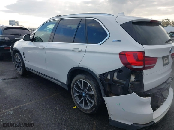 2018 BMW X5 xDrive40e iPerformance with VIN 5UXKT0C58J0V99415, listed as a IAAI auction lot 41391474 with 124,671 mi miles. Bid and sale history available at carsss.com. Image 15.