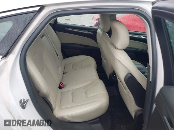 2016 Ford Fusion Titanium with VIN 3FA6P0K98GR369433, listed as a IAAI auction lot 42214785 with 64,918 mi miles and . Bid and sale history available at DreamBid. Image 8.