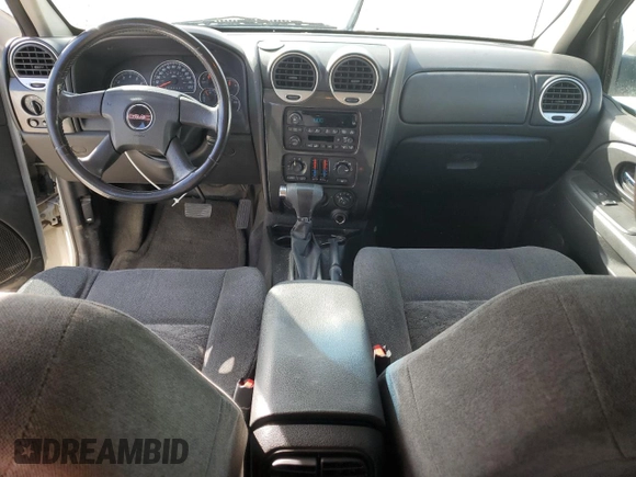 2006 GMC Envoy SLE z VIN 1GKDT13S462156541, wystawiony jako Copart lot #52500615 z przebiegiem 140 558 mil mil oraz Szkody całkowita. Historia ofert i sprzedaży dostępna na DreamBid. Obrazek 8.