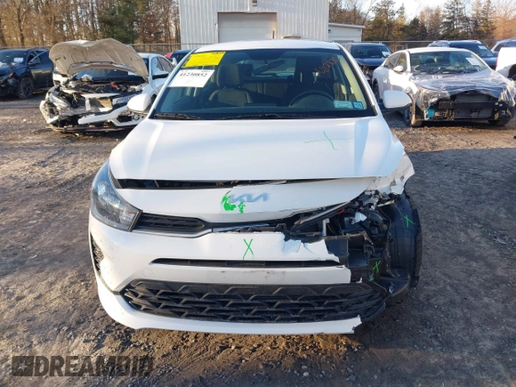 2022 Kia Rio S with VIN 3KPA25AD5NE443465, listed as a IAAI auction lot 41230852 with 20,460 mi miles and . Bid and sale history available at DreamBid. Image 6.