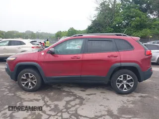 2015 Jeep Cherokee Trailhawk with VIN 1C4PJMBSXFW667469, listed as a IAAI auction lot 42438006 with 127,136 mi miles and . Bid and sale history available at DreamBid. Image 15.