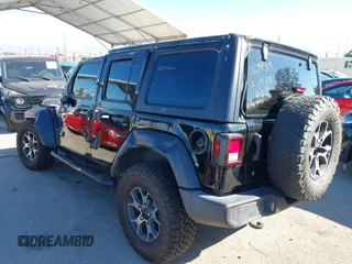2023 Jeep Wrangler Willys with VIN 1C4HJXDN0PW597768, listed as a IAAI auction lot 41645815 with 23,717 mi miles and . Bid and sale history available at DreamBid. Image 3.