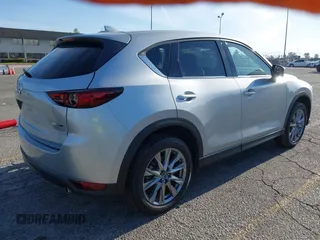 2021 Mazda CX-5 Grand Touring with VIN JM3KFADM1M1393251, listed as a IAAI auction lot 42072862 with 47,758 mi miles. Bid and sale history available at carsss.com. Image 4.