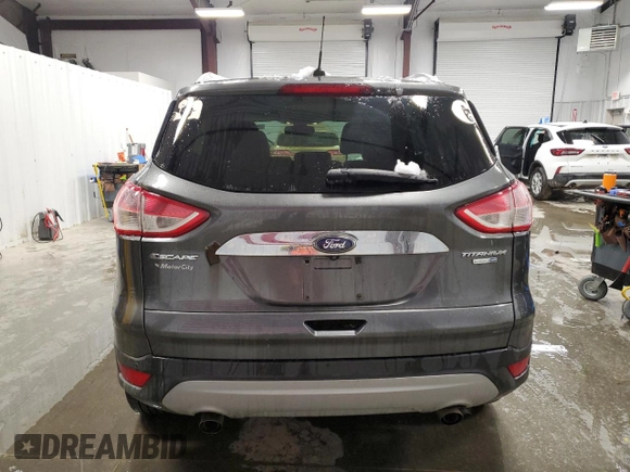 2015 Ford Escape Titanium with VIN 1FMCU9JX0FUA03009, listed as a Copart auction lot 50948755 with 133,748 mi miles and Salvage Title. Bid and sale history available at DreamBid. Image 6.