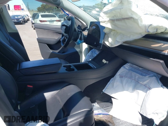 2022 Tesla Model Y Long Range with VIN 7SAYGDEE8NF480939, listed as a IAAI auction lot 41808863 with 62,607 mi miles and . Bid and sale history available at carsss.com. Image 5.