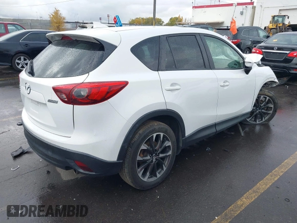 2016 Mazda CX-5 Grand Touring with VIN JM3KE4DY0G0705691, listed as a IAAI auction lot 40880798 with 130,624 mi miles. Bid and sale history available at carsss.com. Image 4.