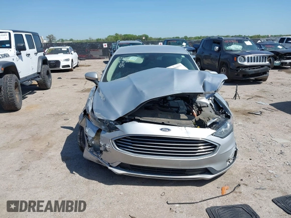 2019 Ford Fusion SE with VIN 3FA6P0LU1KR222141, listed as a IAAI auction lot 42000677 with 122,898 mi miles and . Bid and sale history available at carsss.com. Image 12.