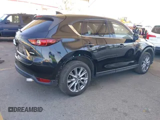 2020 Mazda CX-5 Grand Touring z VIN JM3KFADMXL0740144, wystawiony jako IAAI lot #41830203 z przebiegiem 70 535 mil mil oraz . Historia ofert i sprzedaży dostępna na DreamBid. Obrazek 4.