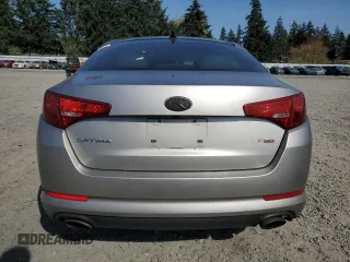 2011 Kia Optima EX z VIN KNAGN4A77B5096621, wystawiony jako Copart lot #53087945 z przebiegiem 189 899 mil mil oraz Szkoda całkowita • Salvage title. Historia ofert i sprzedaży dostępna na DreamBid. Obrazek 6.