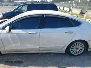2016 Ford Fusion Titanium Hybrid with VIN 3FA6P0RU2GR357739, listed as a IAAI auction lot 42120441 with 151,201 mi miles. Bid and sale history available at carsss.com. Image 14.