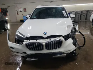 2016 BMW X1 xDrive28i with VIN WBXHT3C3XG5E51117, listed as a Copart auction lot 48243355 with 129,607 mi miles and Salvage Title. Bid and sale history available at carsss.com. Image 5.