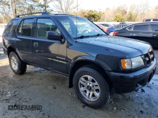 2003 Isuzu Rodeo with VIN 4S2CK58W334306303, listed as a Copart auction lot 83820444 with 180,040 mi miles and Salvage Title. Bid and sale history available at DreamBid. Image 4.