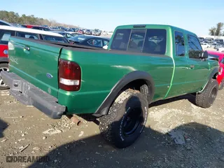 1999 Ford Ranger XLT with VIN 1FTZR15X3XPA13058, listed as a IAAI auction lot 41329263 with 96,926 mi miles. Bid and sale history available at carsss.com. Image 4.