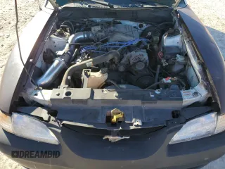 1997 Ford Mustang with VIN 1FALP4043VF174092, listed as a Copart auction lot 86983884 with 105,774 mi miles and Salvage Title. Bid and sale history available at carsss.com. Image 12.
