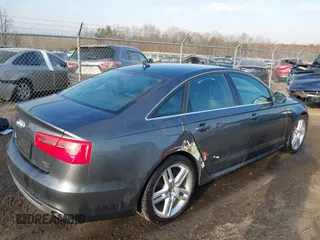 2014 Audi A6 Prestige with VIN WAUHGBFC8EN104920, listed as a IAAI auction lot 41827864 with 70,289 mi miles and . Bid and sale history available at DreamBid. Image 4.