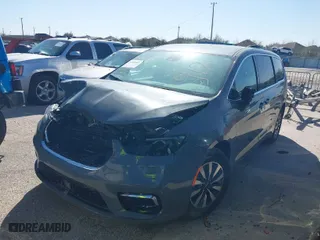 2023 Chrysler Pacifica Hybrid Touring L with VIN 2C4RC1L75PR599135, listed as a IAAI auction lot 39785830 with 28,781 mi miles. Bid and sale history available at carsss.com. Image 2.