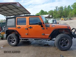 2010 Jeep Wrangler Unlimited Sport with VIN 1J4HA3H1XAL189667, listed as a IAAI auction lot 42062351 with 144,838 mi miles. Bid and sale history available at carsss.com. Image 13.