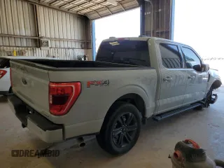 2023 Ford F-150 XL with VIN 1FTFW1E88PFD22387, listed as a Copart auction lot 49795405 with 14,057 mi miles and Salvage Title. Bid and sale history available at carsss.com. Image 3.