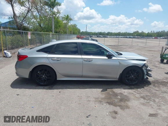 2022 Honda Civic Sport z VIN 2HGFE2F58NH586977, wystawiony jako IAAI lot #42202088 z przebiegiem 56 060 mil mil oraz . Historia ofert i sprzedaży dostępna na DreamBid. Obrazek 13.