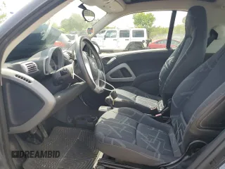 2009 Smart fortwo Pure with VIN WMEEJ31X59K218003, listed as a Copart auction lot 62413775 with 82,711 mi miles and Salvage title. Bid and sale history available at DreamBid. Image 7.