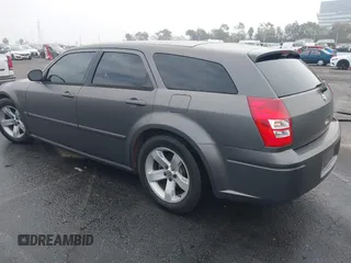 2005 Dodge Magnum RT with VIN 2D4GV58265H500284, listed as a IAAI auction lot 41194672 with 104,894 mi miles. Bid and sale history available at carsss.com. Image 3.