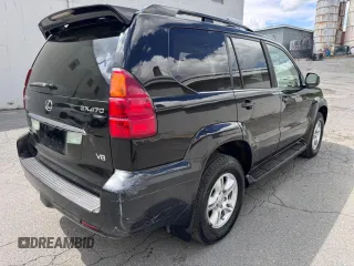 2005 Lexus GX 470 with VIN JTJBT20X050079831, listed as a Copart auction lot 56405105 with 390,415 mi miles and Clean Title. Bid and sale history available at DreamBid. Image 4.