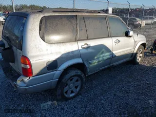 2003 Suzuki XL-7 Touring with VIN JS3TX92V734108202, listed as a IAAI auction lot 41508576 with 169,555 mi miles. Bid and sale history available at carsss.com. Image 4.