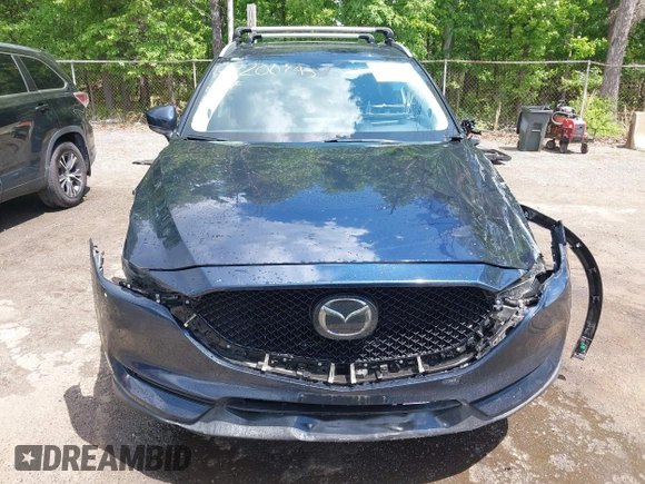 2018 Mazda CX-5 Grand Touring with VIN JM3KFBDM2J0373386, listed as a IAAI auction lot 42200795 with 70,111 mi miles and . Bid and sale history available at DreamBid. Image 13.
