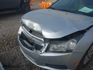 2014 Chevrolet Cruze LS with VIN 1G1PA5SH8E7464530, listed as a IAAI auction lot 41846557 with 122,490 mi miles. Bid and sale history available at carsss.com. Image 6.
